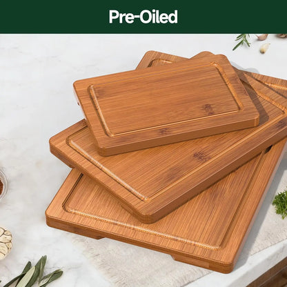 Set of bamboo cutting boards on a light surface with 'Pre-Oiled' text at the top.
